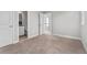 Spacious bedroom with carpet, neutral walls, base molding and an ensuite bath at 1379 Kiawah St, Celebration, FL 34747