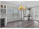Bright dining area with wine storage, hardwood floors, chandelier, and natural light at 1379 Kiawah St, Celebration, FL 34747
