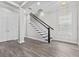 Inviting entryway with wood-look floors, staircase, and an open floorplan at 1379 Kiawah St, Celebration, FL 34747