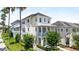 Charming two-story stucco homes with double balconies, landscaped yards, and sidewalks at 1379 Kiawah St, Celebration, FL 34747