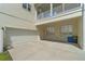 Garage and driveway of the house. Includes garbage cans outside of the garage, as well as the address on the house at 1379 Kiawah St, Celebration, FL 34747