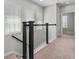 Hallway featuring neutral carpet, staircase, and natural light at 1379 Kiawah St, Celebration, FL 34747