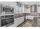 Modern kitchen features stainless appliances, granite countertops, and white cabinetry at 1379 Kiawah St, Celebration, FL 34747
