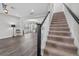 Open living room with hardwood floors and stairs leading to upper level of home at 1379 Kiawah St, Celebration, FL 34747