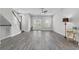 Bright living room featuring hardwood floors, modern ceiling fan, and light gray walls at 1379 Kiawah St, Celebration, FL 34747
