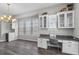 Bright office space featuring built-in desk with granite countertops, ample cabinet space, and natural light from multiple windows at 1379 Kiawah St, Celebration, FL 34747