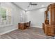 Office/study room with built-in desk and cabinets, ceiling fan, and natural light at 1379 Kiawah St, Celebration, FL 34747