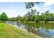 Community pond surrounded by lush landscaping and trees, creating a tranquil environment at 1379 Kiawah St, Celebration, FL 34747