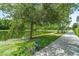 Community pond showcasing lush greenery, walking path, and a peaceful atmosphere at 1379 Kiawah St, Celebration, FL 34747