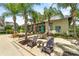 Community pool featuring lounge chairs, tables, umbrellas, and a covered area for relaxation at 1379 Kiawah St, Celebration, FL 34747