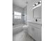 Bathroom featuring updated tile, shower and tub combo and modern fixtures at 14639 Musket Fire Ln, Orlando, FL 32837