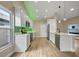 Bright open kitchen with white cabinets, stainless steel appliances, and a breakfast bar with pendant lighting at 14639 Musket Fire Ln, Orlando, FL 32837