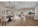 Spacious living area with modern decor, featuring a dining area, kitchen bar, and comfortable seating at 14639 Musket Fire Ln, Orlando, FL 32837