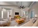 Cozy living room featuring vaulted ceilings, neutral tones, and comfortable seating arrangements with lots of light at 14639 Musket Fire Ln, Orlando, FL 32837
