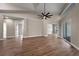 Spacious living room with light wood floors, recessed lighting, ceiling fan, and large sliding glass doors at 14639 Musket Fire Ln, Orlando, FL 32837