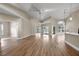 The spacious living space has high ceilings, sleek flooring, and pool access for seamless indoor-outdoor living at 14639 Musket Fire Ln, Orlando, FL 32837