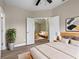 Tranquil primary bedroom with luxury vinyl floors and doorway view to additional bedroom at 14639 Musket Fire Ln, Orlando, FL 32837