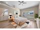 The main bedroom boasts a large window with a view of the pool, high ceilings, and modern decor at 14639 Musket Fire Ln, Orlando, FL 32837