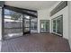 Screened in brick patio with view to backyard, fence, and access to inside of house at 14639 Musket Fire Ln, Orlando, FL 32837
