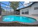 Beautifully maintained pool is fully screened in for pest-free swimming and outdoor relaxation at 14639 Musket Fire Ln, Orlando, FL 32837
