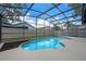 This beautiful screened in pool is the perfect place to cool off and relax on a hot day at 14639 Musket Fire Ln, Orlando, FL 32837
