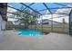 Inviting screened in pool features a unique shape and provides the perfect outdoor oasis at 14639 Musket Fire Ln, Orlando, FL 32837