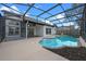 Screened in pool with plenty of patio space for entertaining or enjoying a relaxing swim at 14639 Musket Fire Ln, Orlando, FL 32837