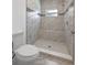 Updated bathroom with marble tile, mosaic accents, and tiled shower at 14639 Musket Fire Ln, Orlando, FL 32837