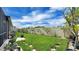 Manicured backyard featuring lush green grass and beautiful tropical landscaping at 148 Whirlaway Dr, Davenport, FL 33837