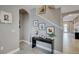 Entryway featuring an arched doorway, decorative console table, and neutral wall decor at 148 Whirlaway Dr, Davenport, FL 33837