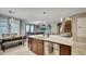 Open-concept kitchen featuring a large island, granite countertops, and modern stainless steel appliances at 148 Whirlaway Dr, Davenport, FL 33837