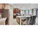 Spacious kitchen featuring an island, stainless steel appliances, and tile flooring at 148 Whirlaway Dr, Davenport, FL 33837