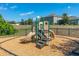Community playground with slide, climbing structure, and safety surface at 148 Whirlaway Dr, Davenport, FL 33837