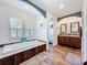 Bright bathroom featuring a soaking tub and double sink vanity at 15311 Johns Lake Rd, Clermont, FL 34711