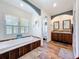 Bright bathroom featuring a soaking tub and double sink vanity at 15311 Johns Lake Rd, Clermont, FL 34711