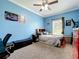 Blue bedroom with carpet and large window providing natural light at 15311 Johns Lake Rd, Clermont, FL 34711
