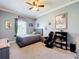 Well-lit bedroom with carpet, neutral colors, crown molding and a large window at 15311 Johns Lake Rd, Clermont, FL 34711