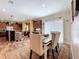 Charming dining room leading to open kitchen with hardwood floors and sliding glass doors at 15311 Johns Lake Rd, Clermont, FL 34711