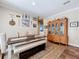 Cozy dining room featuring a large china cabinet, wood floors, decor, and neutral walls at 15311 Johns Lake Rd, Clermont, FL 34711