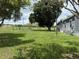 Manufactured home on a large lot with mature landscaping at 15311 Johns Lake Rd, Clermont, FL 34711