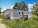 Well-maintained home with a charming exterior, complete with a deck and lush green lawn at 15311 Johns Lake Rd, Clermont, FL 34711