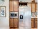 Charming kitchen features stainless steel appliances, custom cabinets, and tile backsplash at 15311 Johns Lake Rd, Clermont, FL 34711