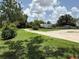 Spacious yard with mature trees, a camper, and a shed at 15311 Johns Lake Rd, Clermont, FL 34711