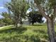 Manufactured home set back from the road with mature trees at 15311 Johns Lake Rd, Clermont, FL 34711