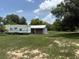 Large lot with a camper and a utility shed at 15311 Johns Lake Rd, Clermont, FL 34711