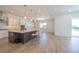 Modern kitchen with a large island, stainless steel appliances, and sleek countertops at 15600 Vetta Dr, Bella Collina, FL 34756