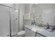 Clean, bright bathroom featuring a glass shower and modern vanity with elegant decor and neutral tones at 1565 Plunker Dr, Davenport, FL 33896