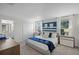 Comfortable bedroom featuring a queen-sized bed, soft carpet and lots of natural light from two large windows at 1565 Plunker Dr, Davenport, FL 33896
