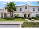 Inviting townhome exterior with well-manicured landscaping and a charming tile roof at 1565 Plunker Dr, Davenport, FL 33896