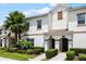 Inviting townhouses with manicured greenery and architectural details with warm accents at 1565 Plunker Dr, Davenport, FL 33896